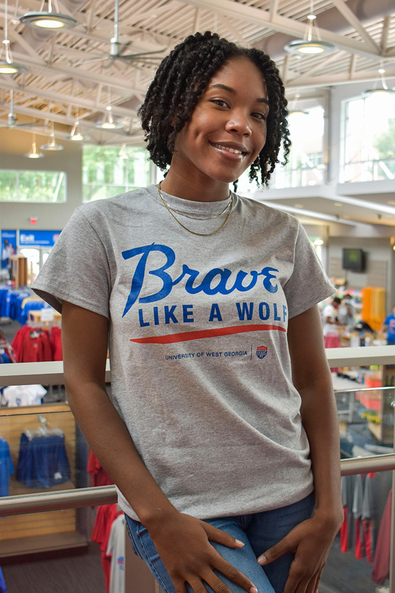 image of: BRAVE LIKE A WOLF TSHIRT SCRIPT UWG SHIELD LOGO